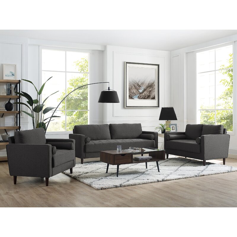 Comfortable living room sofa with square arms and throw pillows.