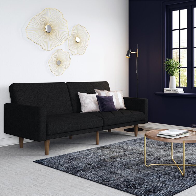 Wide upholstered sofa with adjustable back sections and chaise lounge functionality.