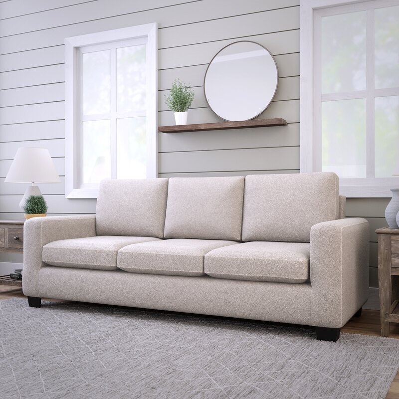 Living room sofa with reversible seat cushions for even wear