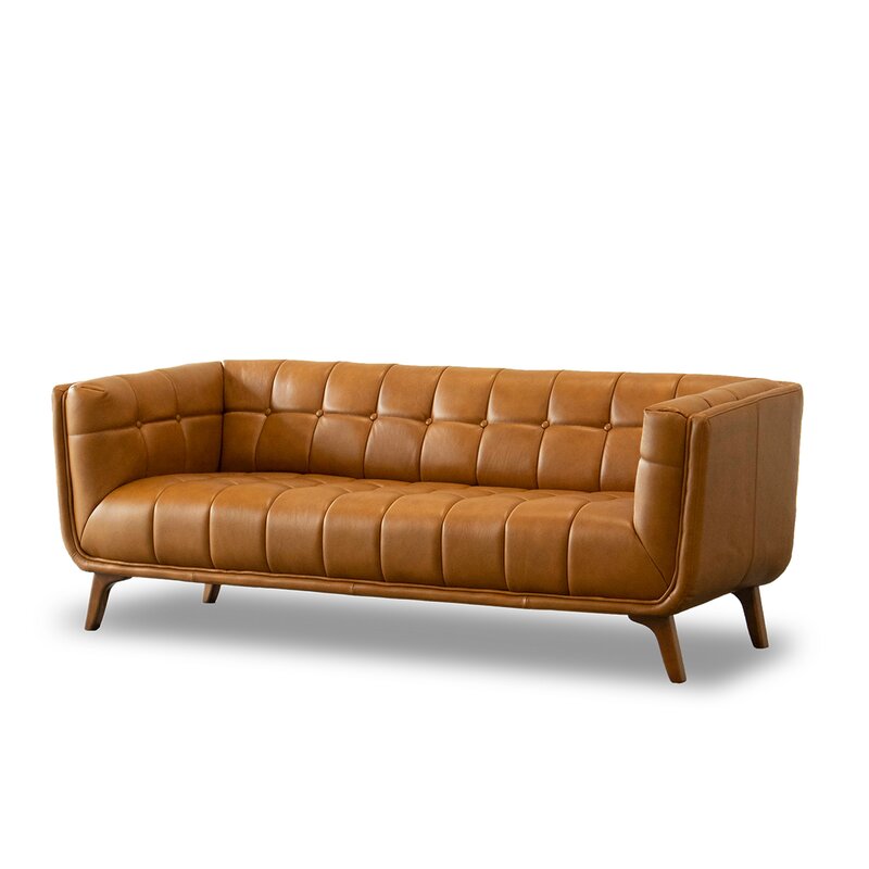 Deep-seat genuine leather couch in a modern living room setting.
