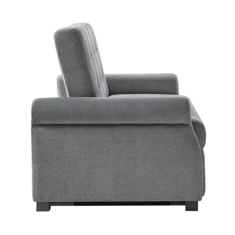 Dark gray fabric sofa bed with decorative button tufting.
