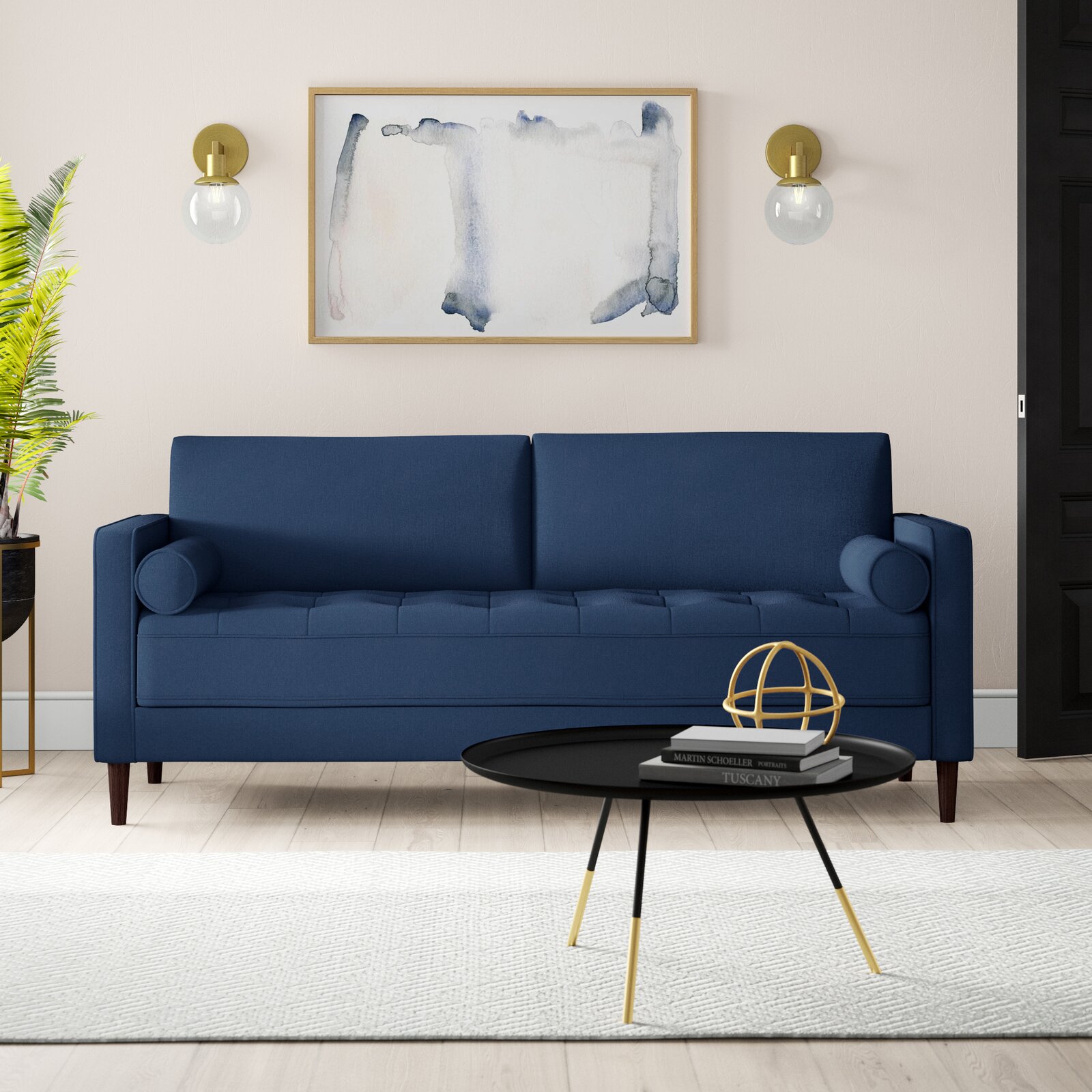 Gray fabric sofa with tailored square arms and button tufting detail.