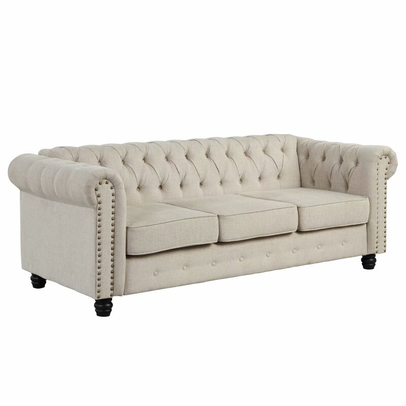 Elegant rolled-arm sofa with nailhead trim detail