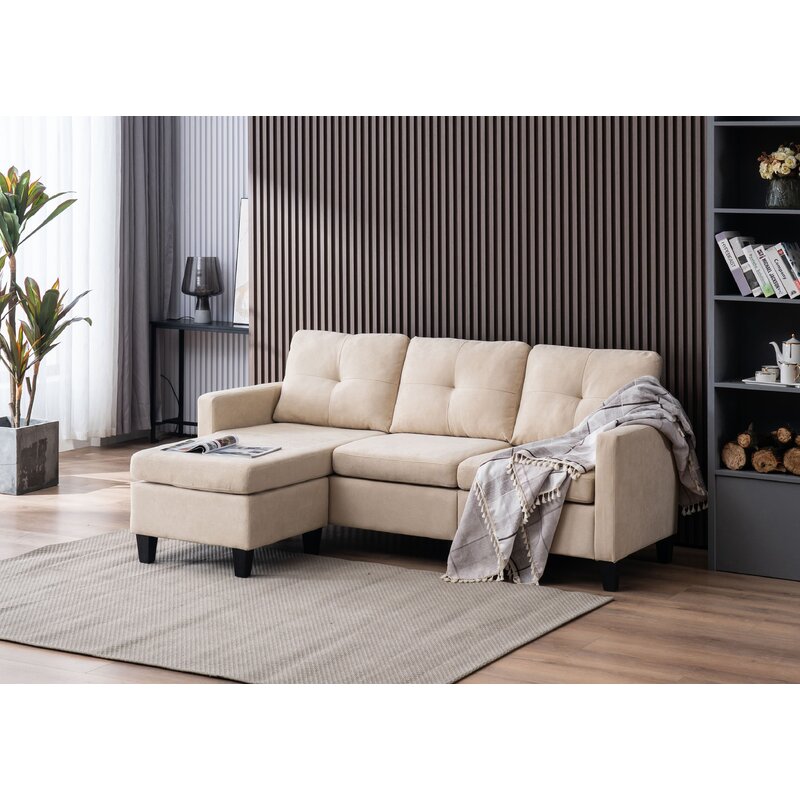 Adaptable L-shaped sofa configuration with chaise lounge and footrest ottoman