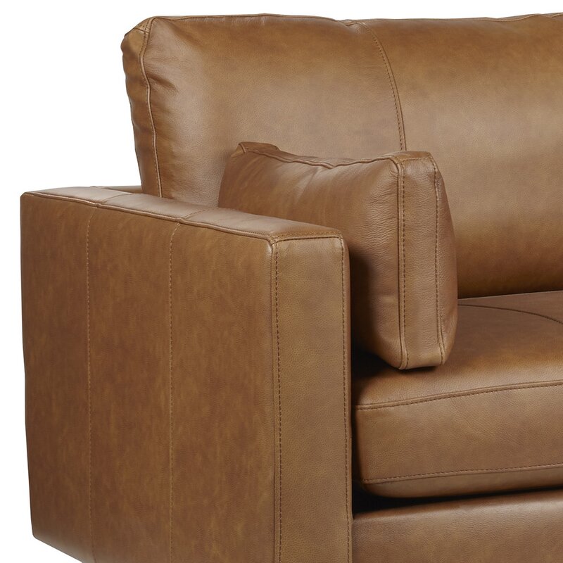The sofa in a neutral-toned room demonstrating its versatile style.