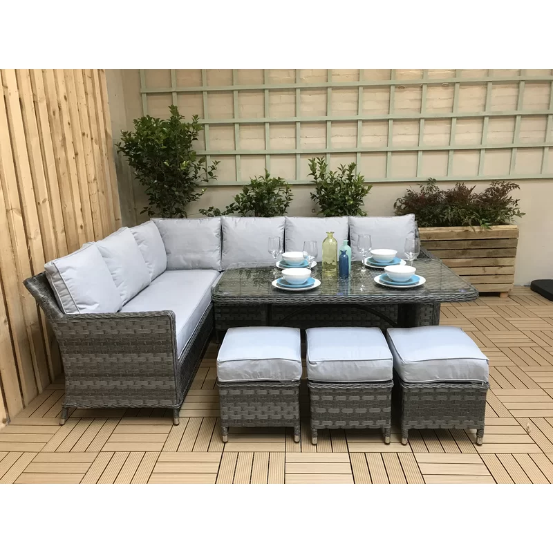 Large garden furniture set with a coffee table on a stone patio