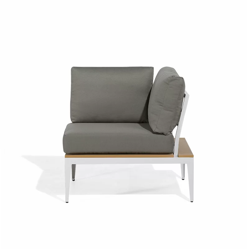 Side view of the lounge chair showing its reclined back and armrest.