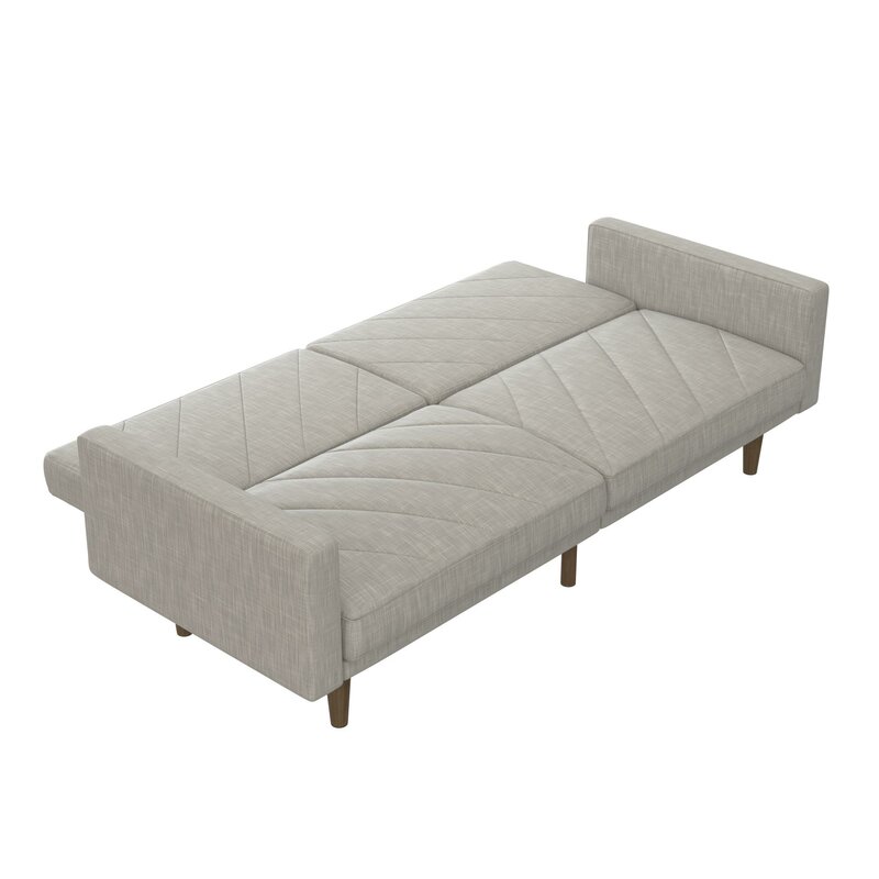 A modern convertible sofa with a wide seat and split backrest in a neutral fabric.