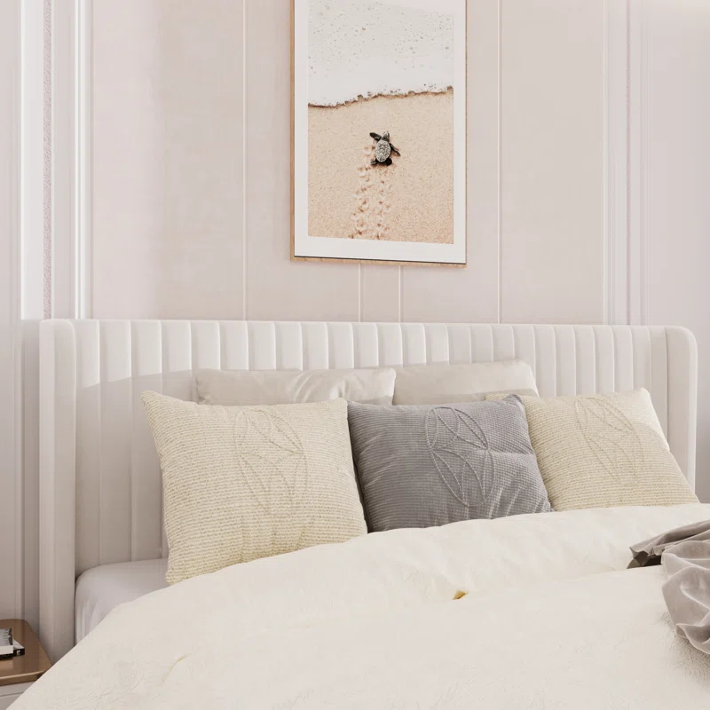 A classic tufted wingback bed frame in a neutral fabric.