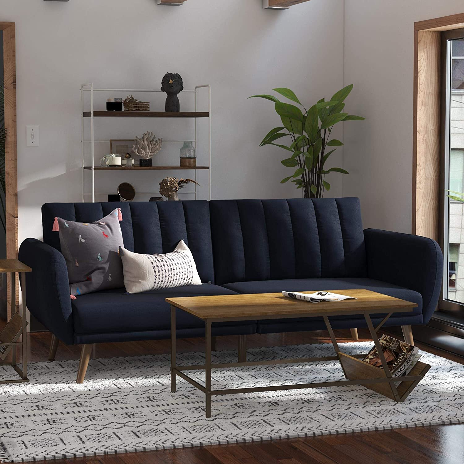 Convertible sofa bed in a small living room.