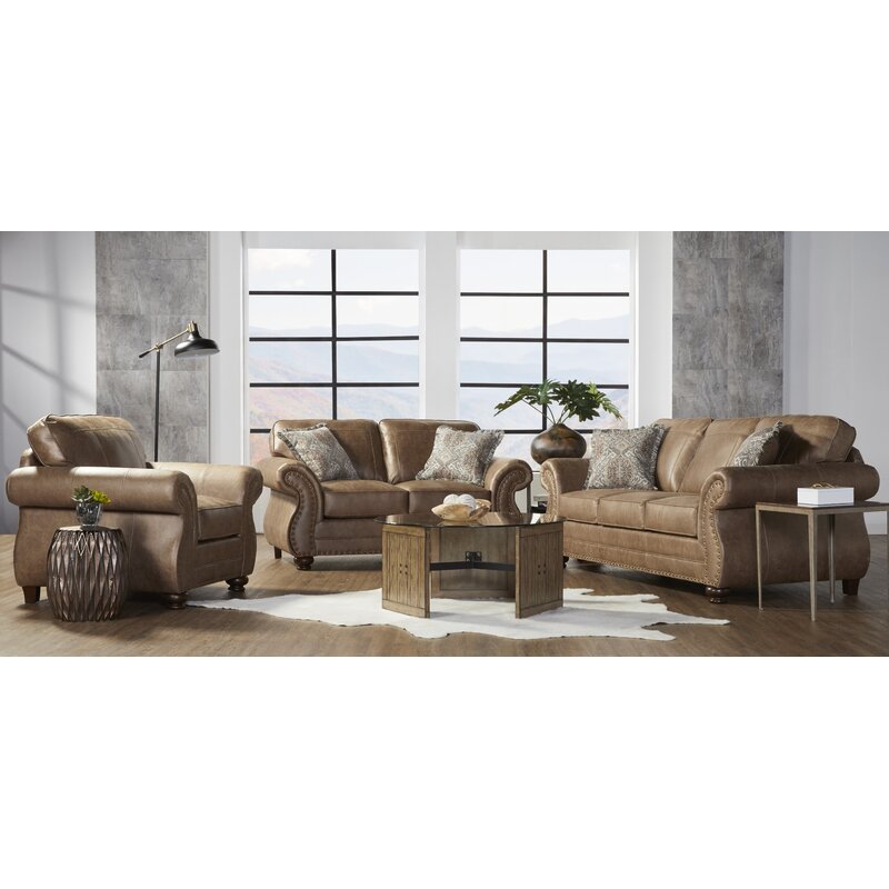 Curved silhouette sofa in a neutral fabric upholstery