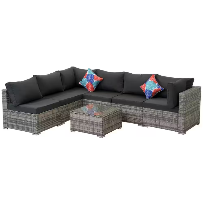 Gray wicker outdoor sectional sofa arranged on a patio