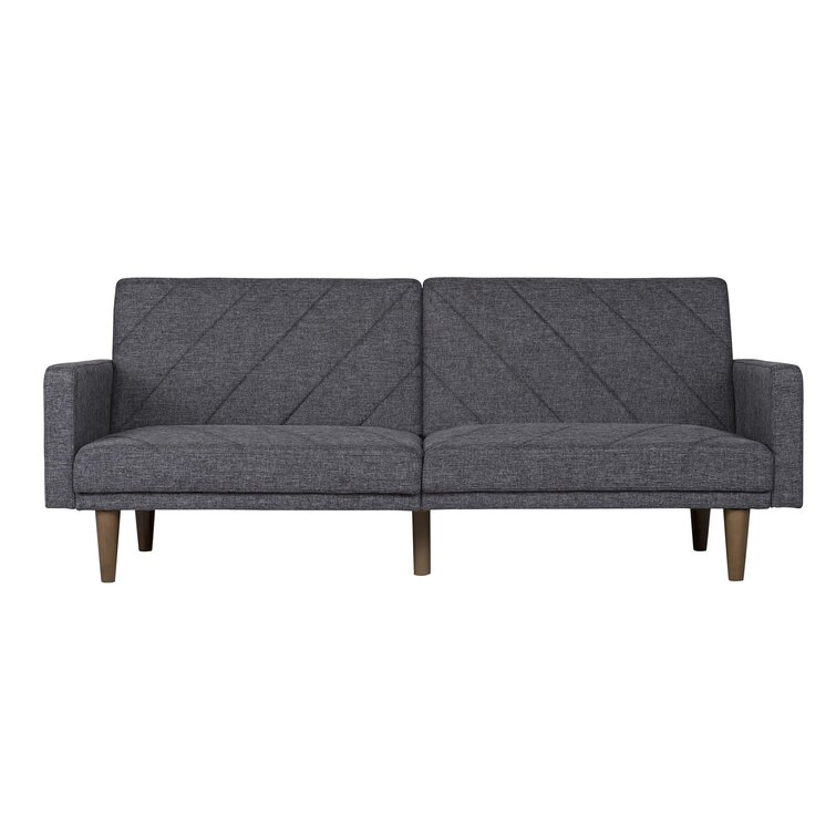 Neutral colored sectional sofa with movable back cushions for flexible seating.