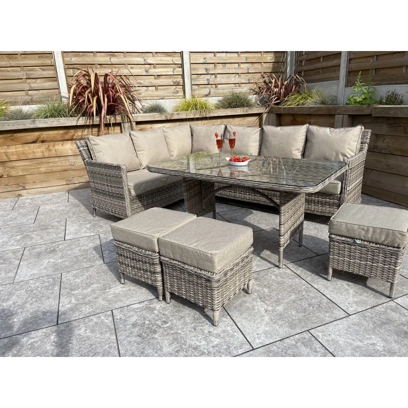 Large garden furniture set with a coffee table on a stone patio
