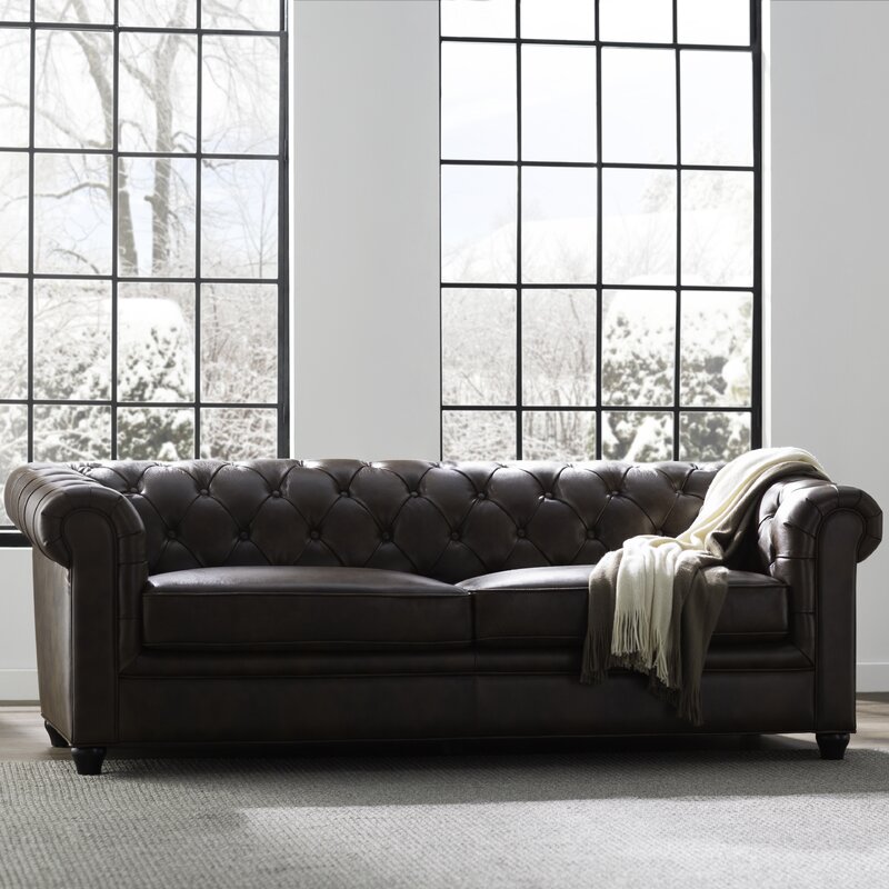 Classic Chesterfield sofa in genuine leather with deep button tufting