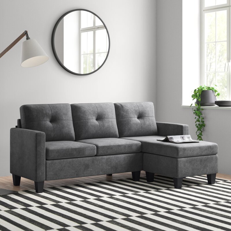 Modular couch pieces arranged in a versatile layout with reversible chaise