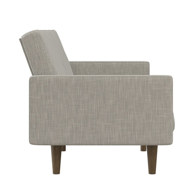 Convertible sofa bed with split back design shown in a contemporary setting.