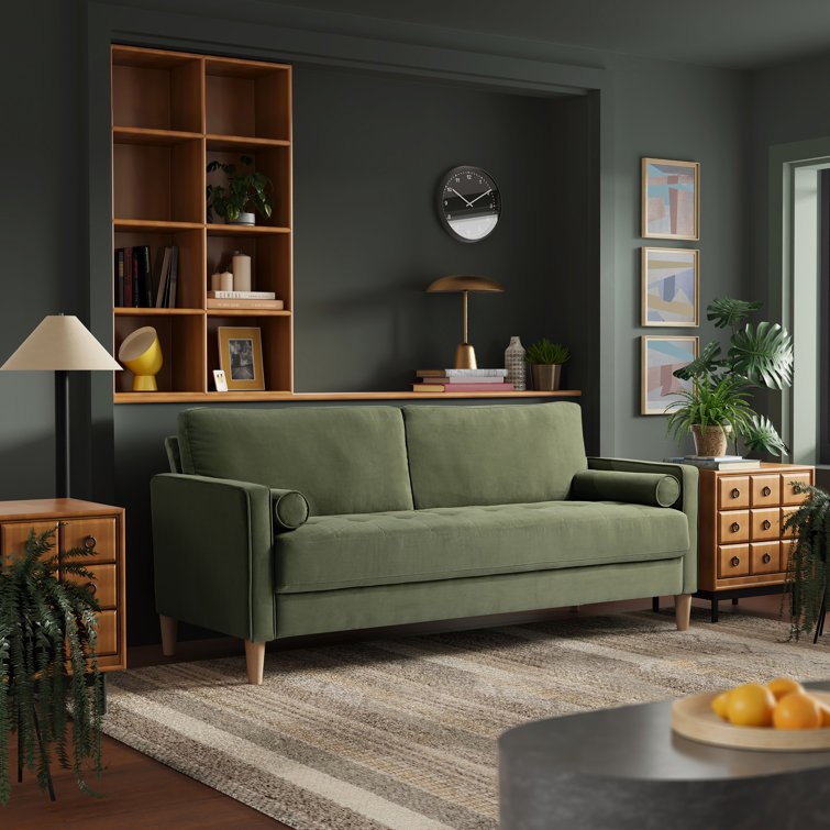 Deep-seated tufted sofa with clean square arms and neutral fabric.
