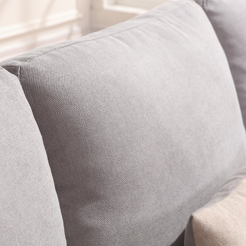Living room scene featuring the light gray sectional as a comfortable focal point for relaxation.