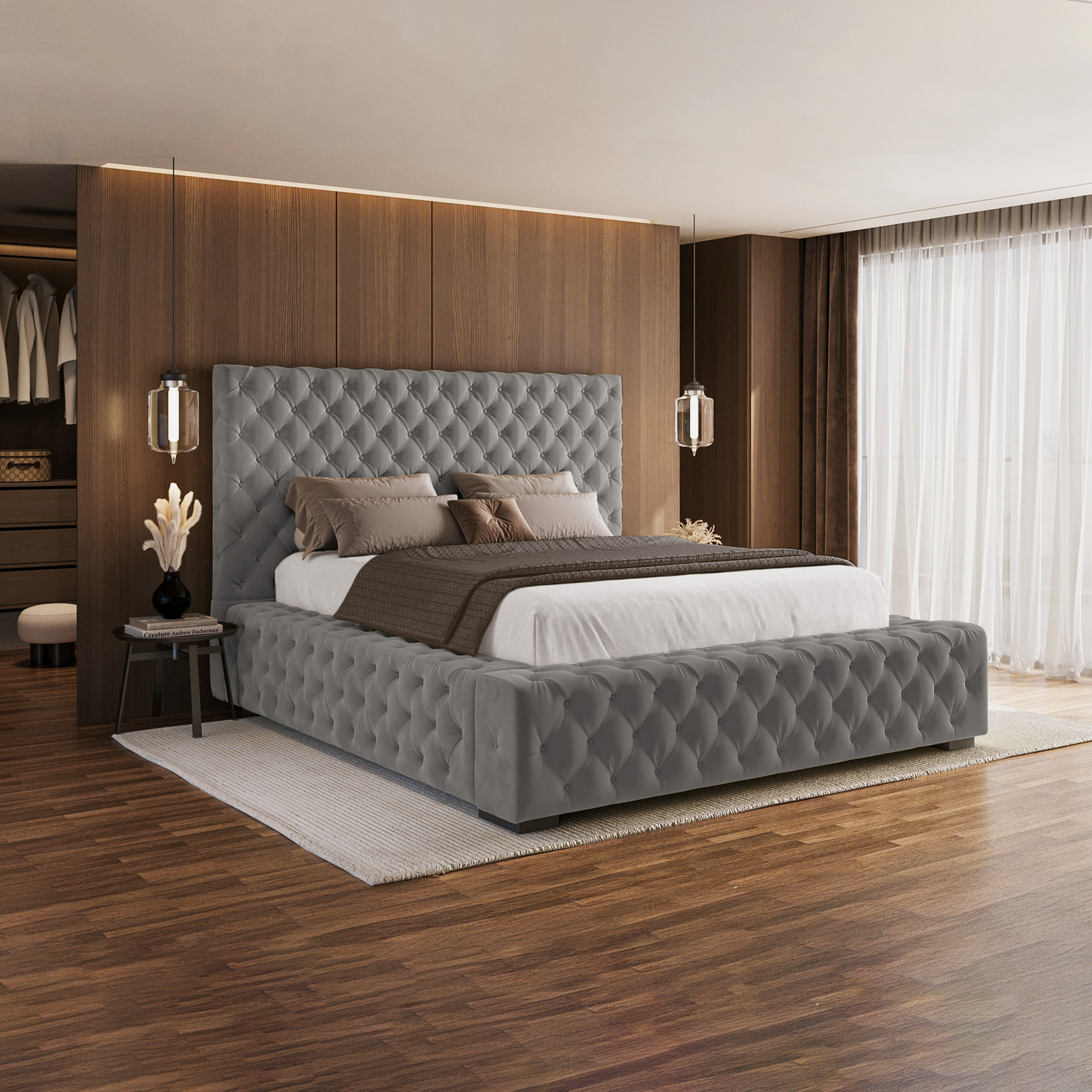 A modern grey velvet upholstered bed frame with a tall padded headboard.