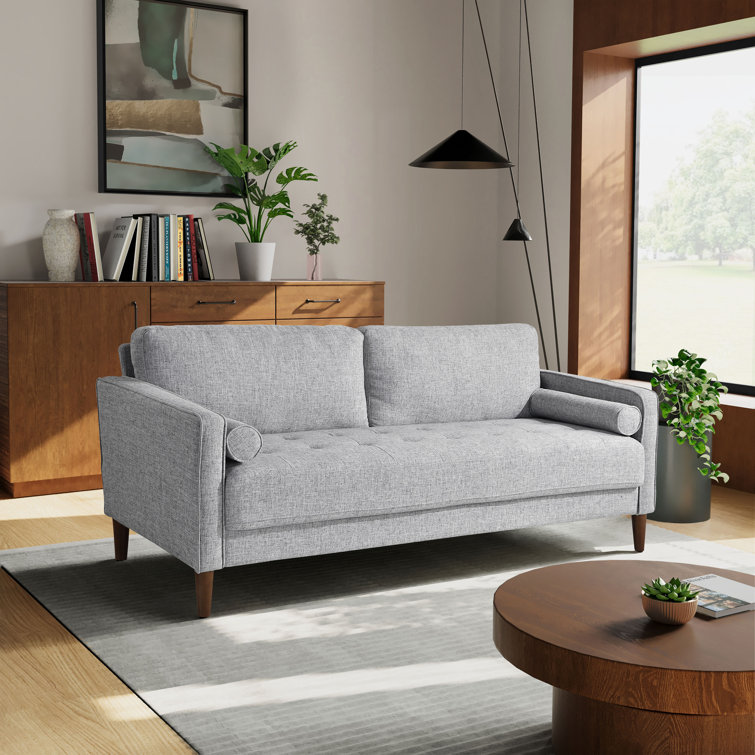 Spacious sectional sofa with plush cushions and square arm design.
