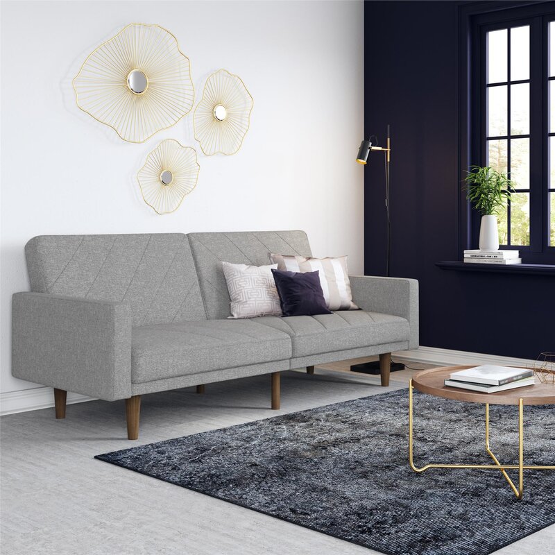 Versatile sofa with independent reclining back sections in a spacious living room.