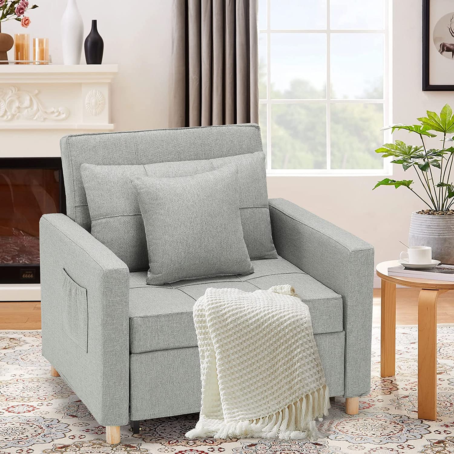 Space-saving convertible sofa bed in a studio apartment setting.