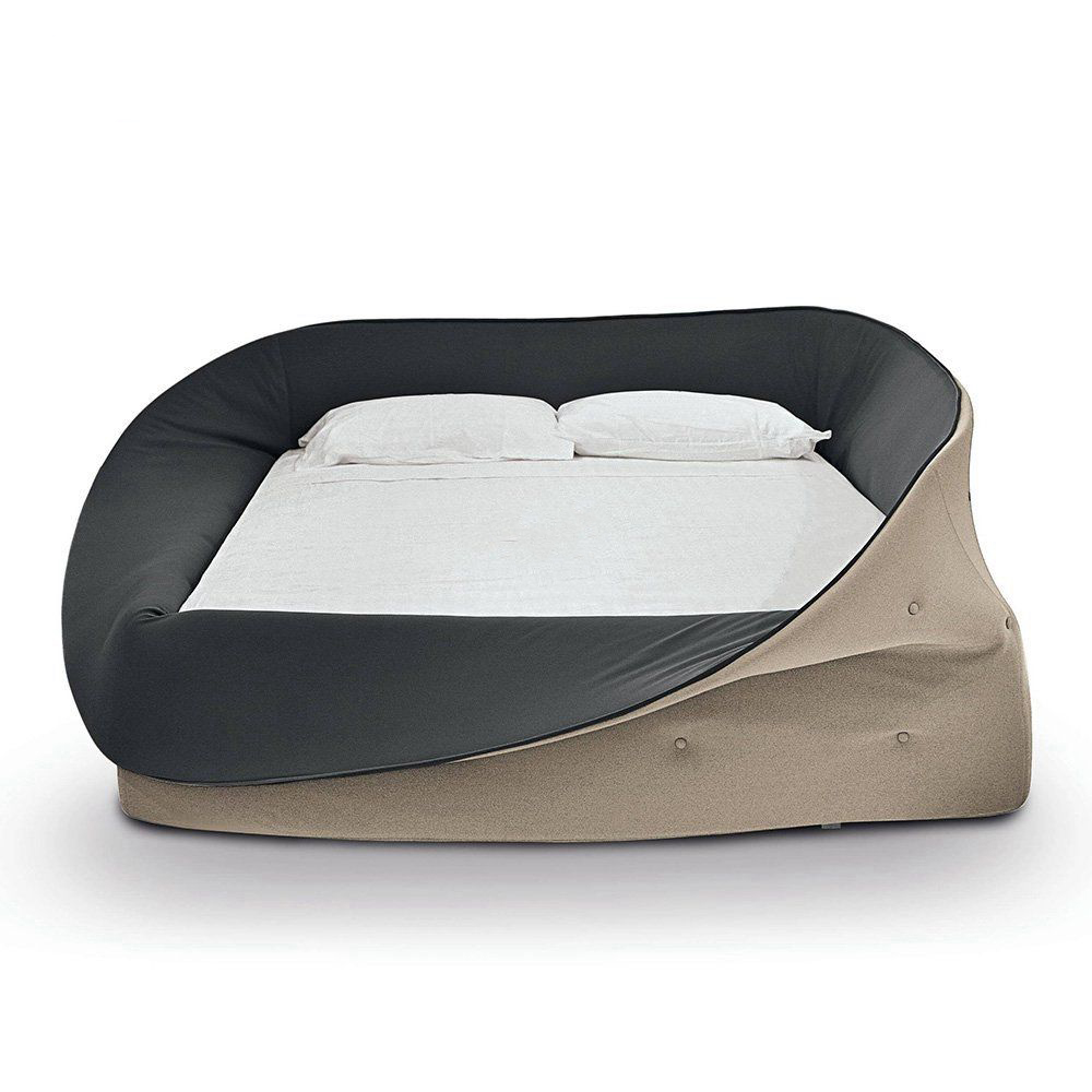 Simple designer platform bed with a textured headboard in a neutral bedroom setting.