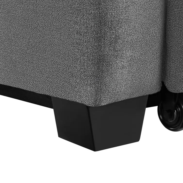 Tufted back and rolled arm convertible sofa in a contemporary space.