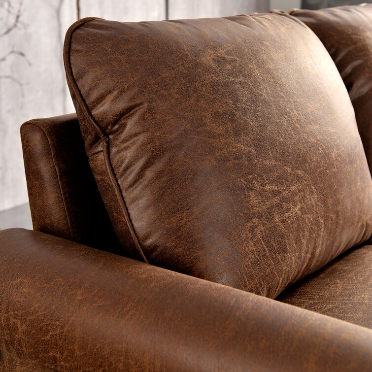 Upholstered sofa with structured rolled arms and wooden leg details.