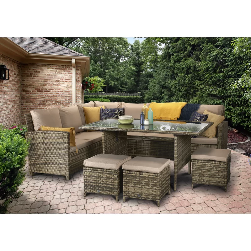 Close-up view of the textured all-weather wicker material and cushion stitching.