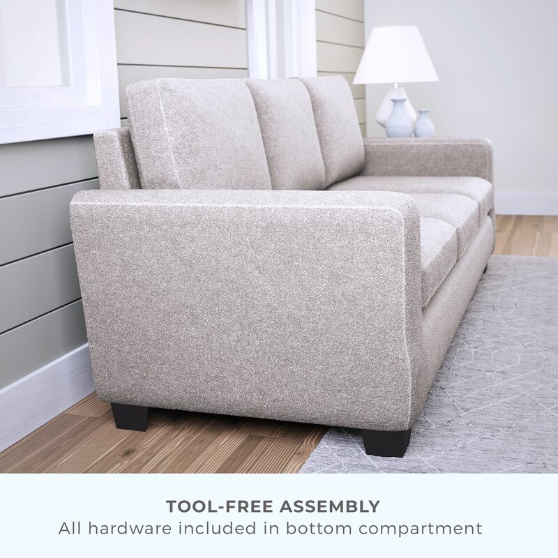 Upholstered sofa featuring durable, double-sided cushions