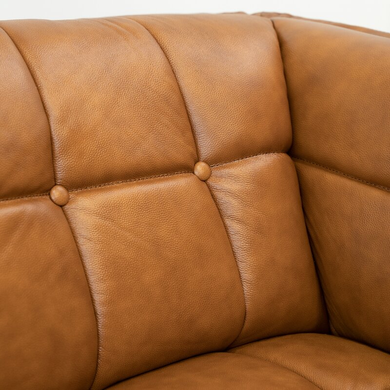 Close-up detail of the sofa's soft, premium leather upholstery.