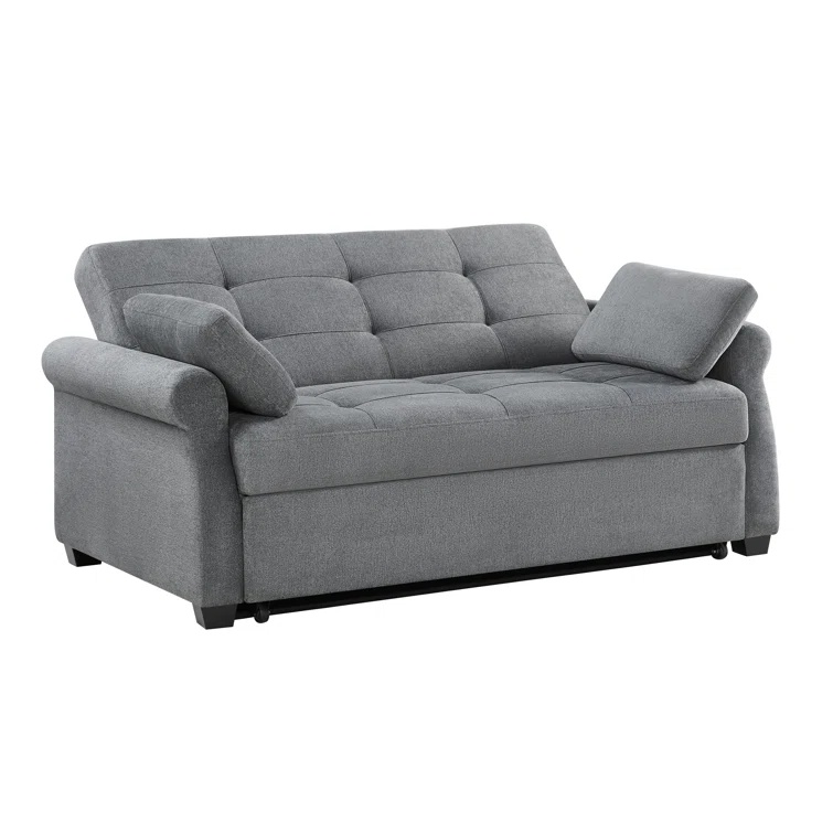 Tufted back and rolled arm convertible sofa in a contemporary space.