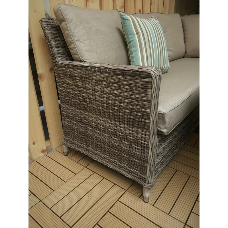 Large garden furniture set with a coffee table on a stone patio