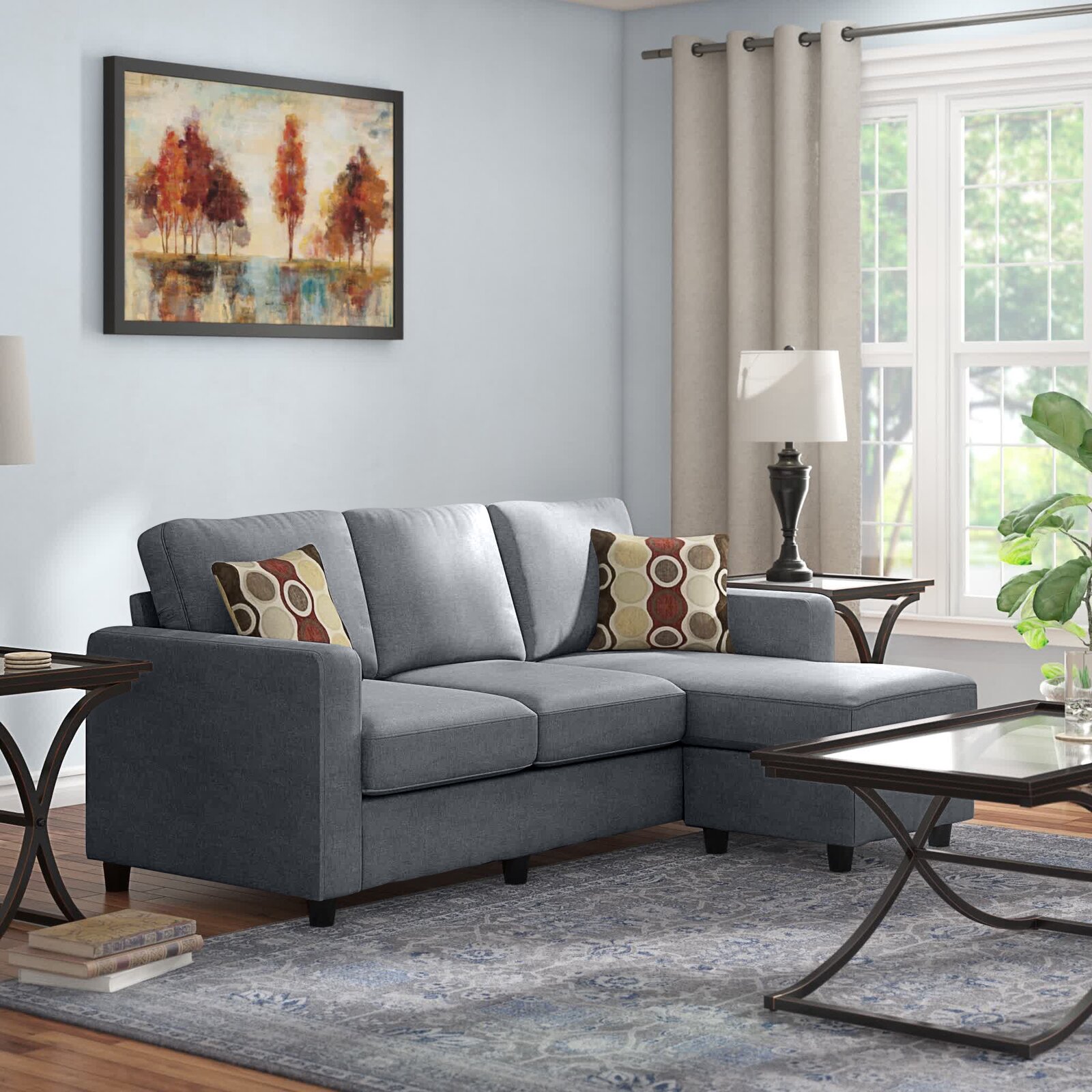 Reversible chaise lounge and ottoman positioned for versatile living room layouts.