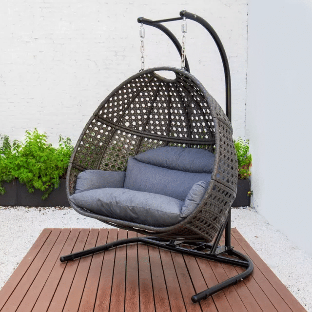 The sturdy metal stand and hanging hardware of the patio swing.