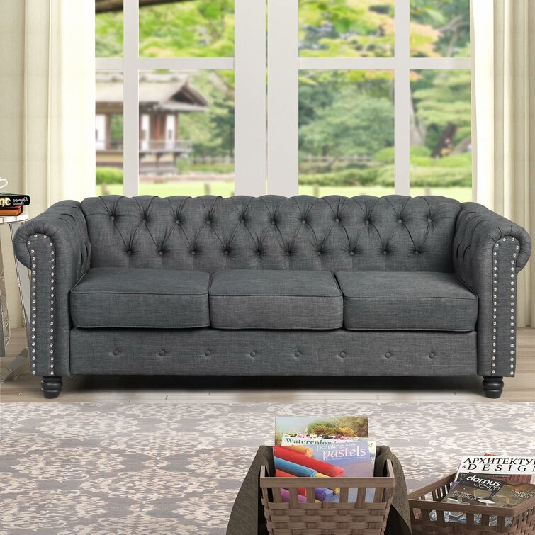 Traditional rolled-arm sofa in a rich leather upholstery