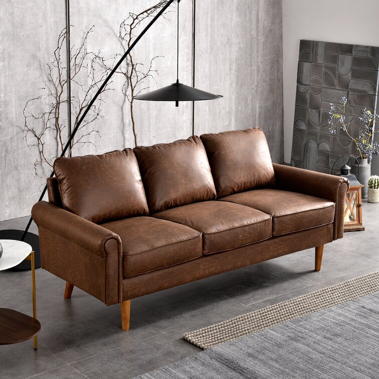 Comfortable living room sofa featuring a timeless rolled arm design.
