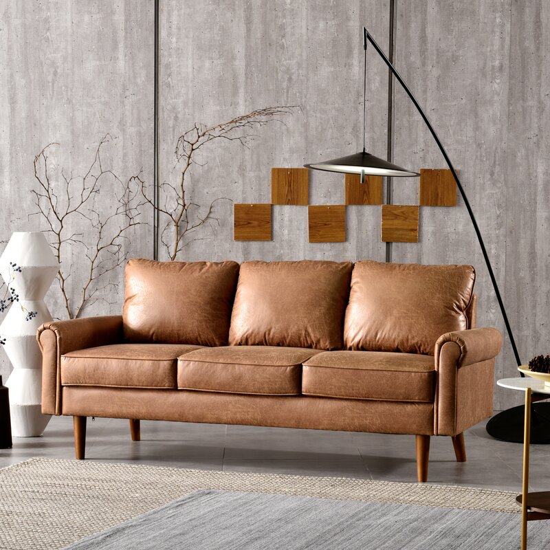 Ainsley sofa showcasing a traditional rolled arm profile and tapered leg design.