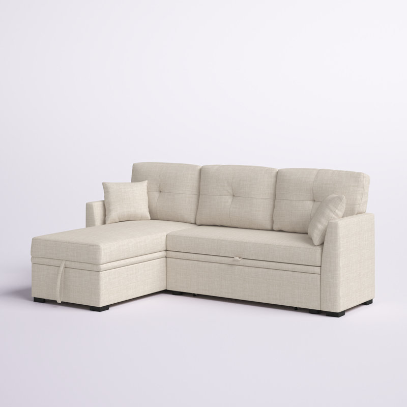 A large modern gray sleeper sofa with chaise in a contemporary living room.