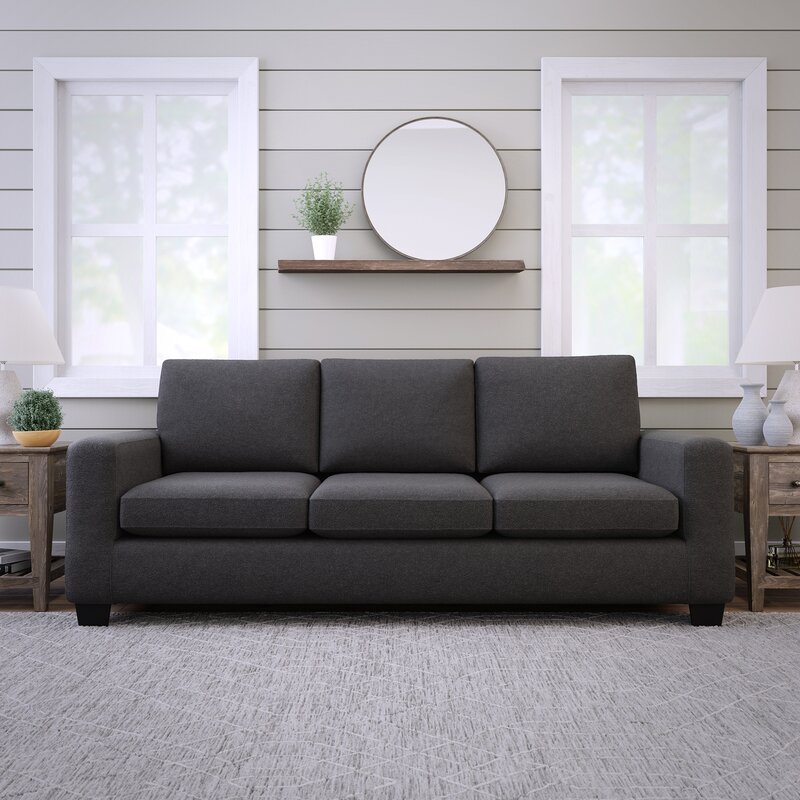 A modern sofa with clean square arms and plush cushions