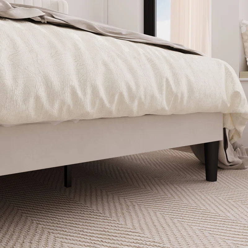 Tall upholstered headboard bed with wingback sides.