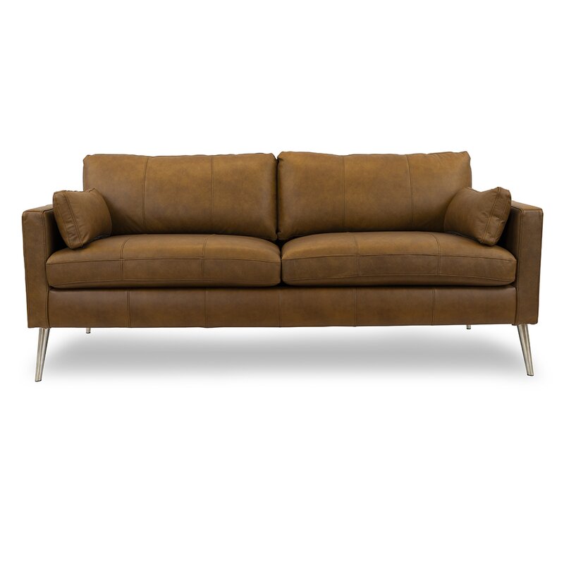 Corner detail showing the construction of the leather sofa's square arm.