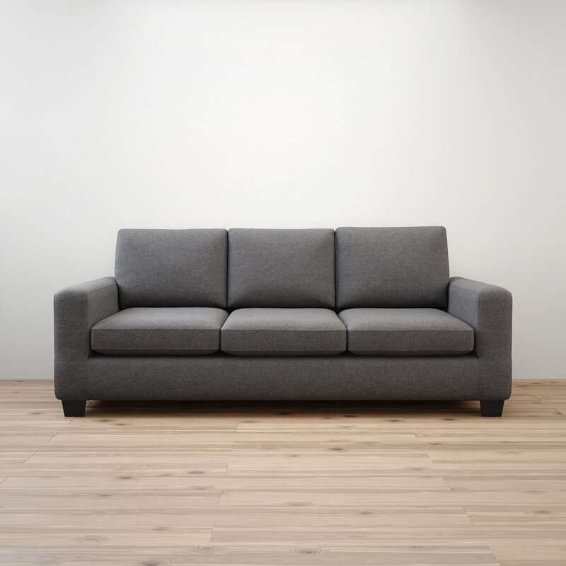 A modern sofa with clean square arms and plush cushions