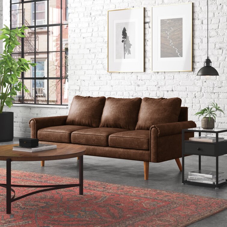 Traditional rolled arm sofa with clean lines and elegant tapered legs.