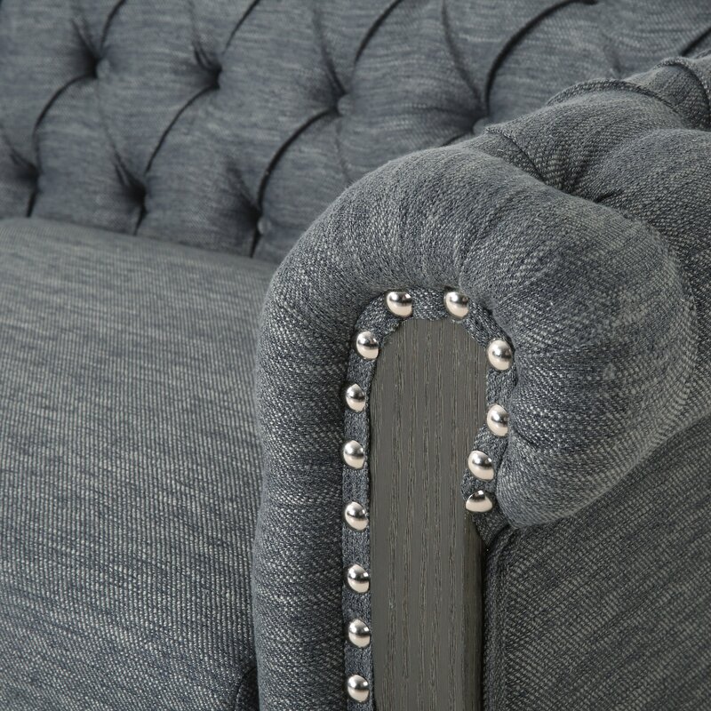 Timeless Chesterfield couch with classic brown leather and tufted details