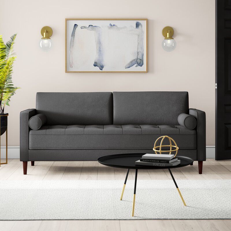 Upholstered sofa with square silhouette and wooden legs.