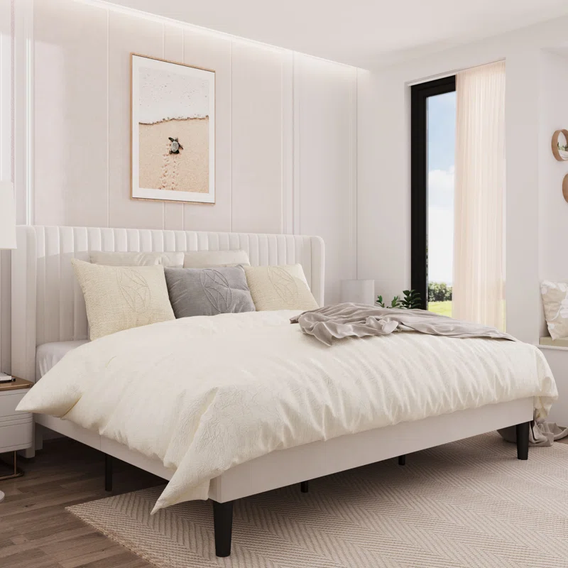 Elegant tufted headboard bed in a neutral bedroom setting.
